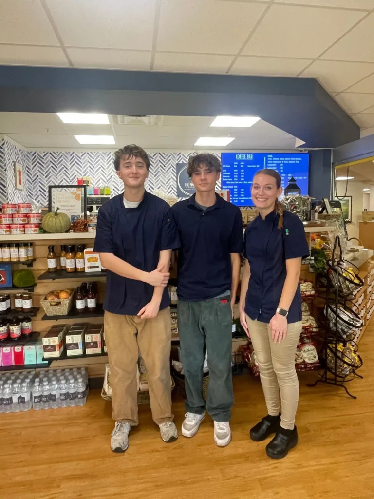 Seniors William Mehan and Nick Zlotorzynski intern at the cafe under the supervision of manager Anna Butler.