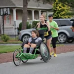 Athlete Adria Seely is pushed by wingmen Claire Moreno and Adria